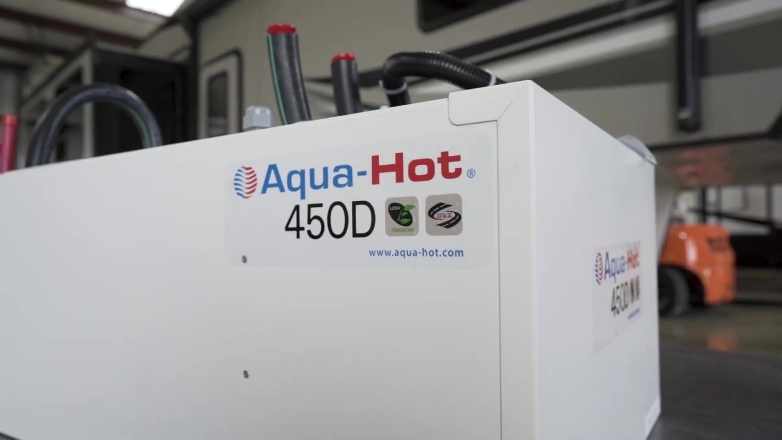 aqua-hot-450d-unit-closeup Close up of an Aqua Hot 450D hydronic heating unit